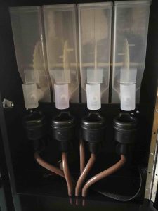 powder canisters in vending machine